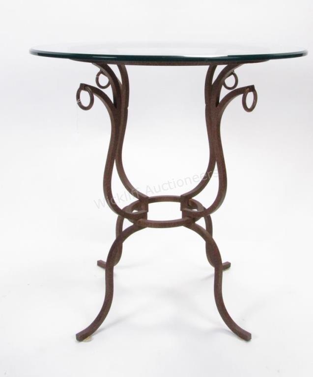 Appraisal: A decorator-quality end table wrought iron base beveled glass top