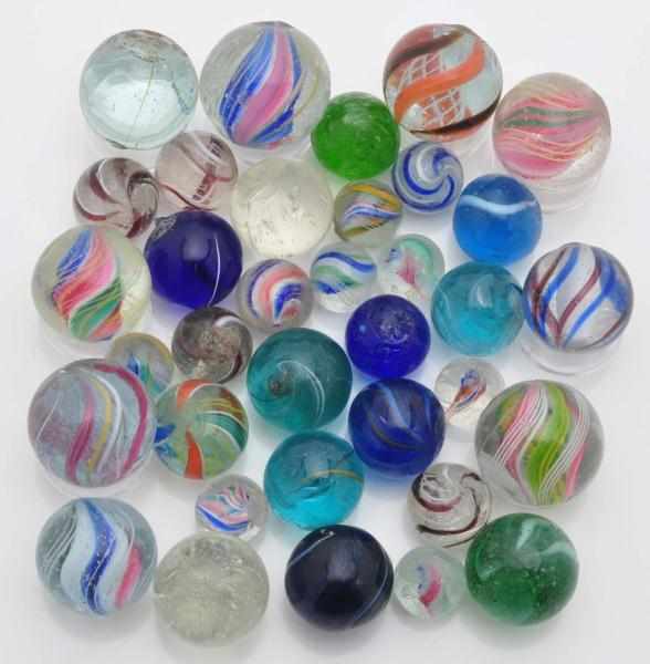 Appraisal: Lot of Handmade Marbles Description Includes latticino solid and divided