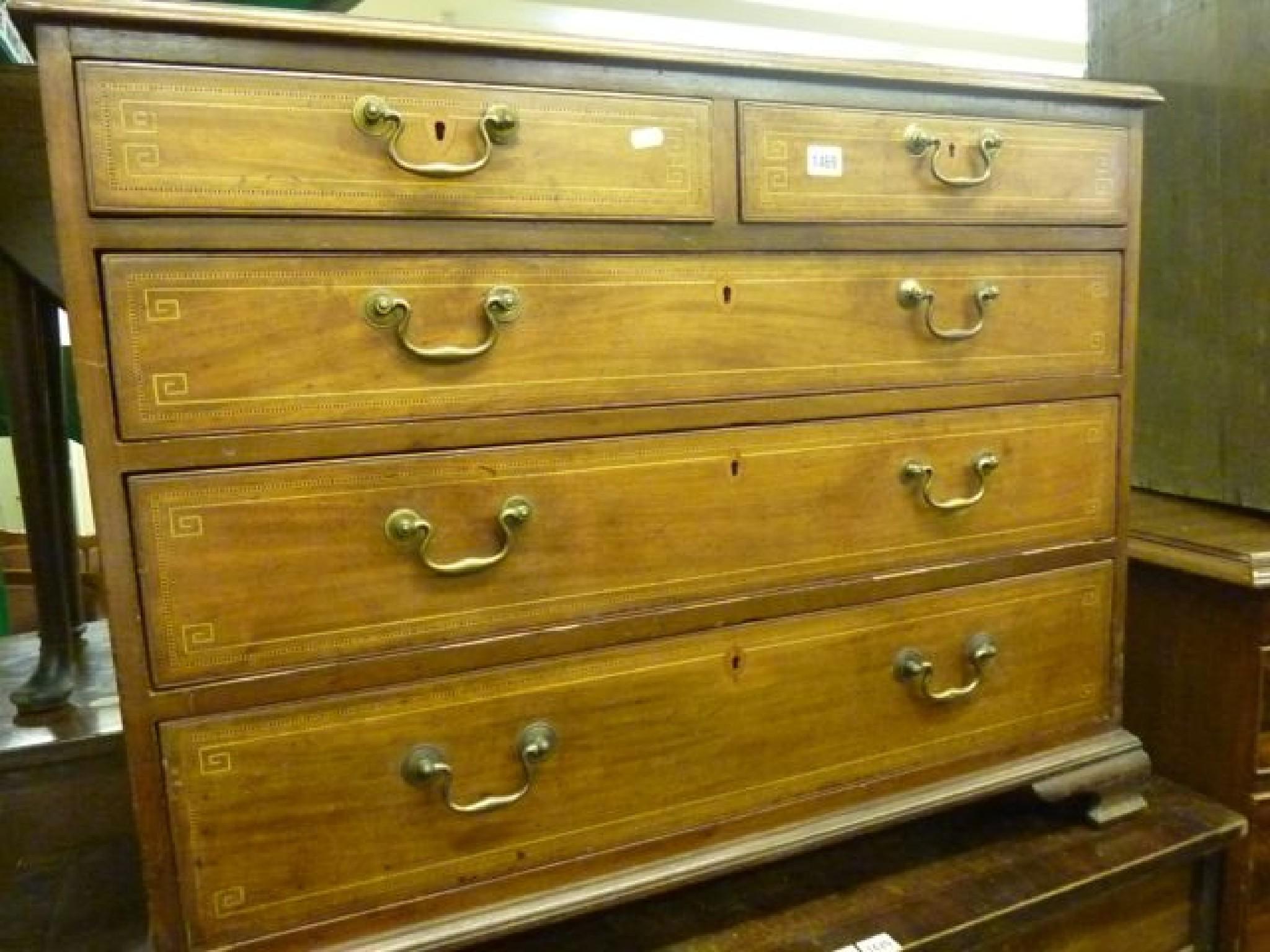 Appraisal: A Georgian mahogany chest fitted with three long and two