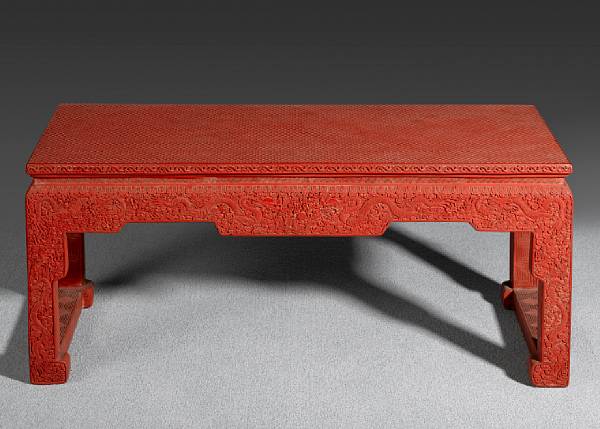 Appraisal: A large cinnabar lacquer kang table kang zhuo th Century