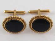 Appraisal: A pair of yellow metal tests carat gold onyx cufflinks