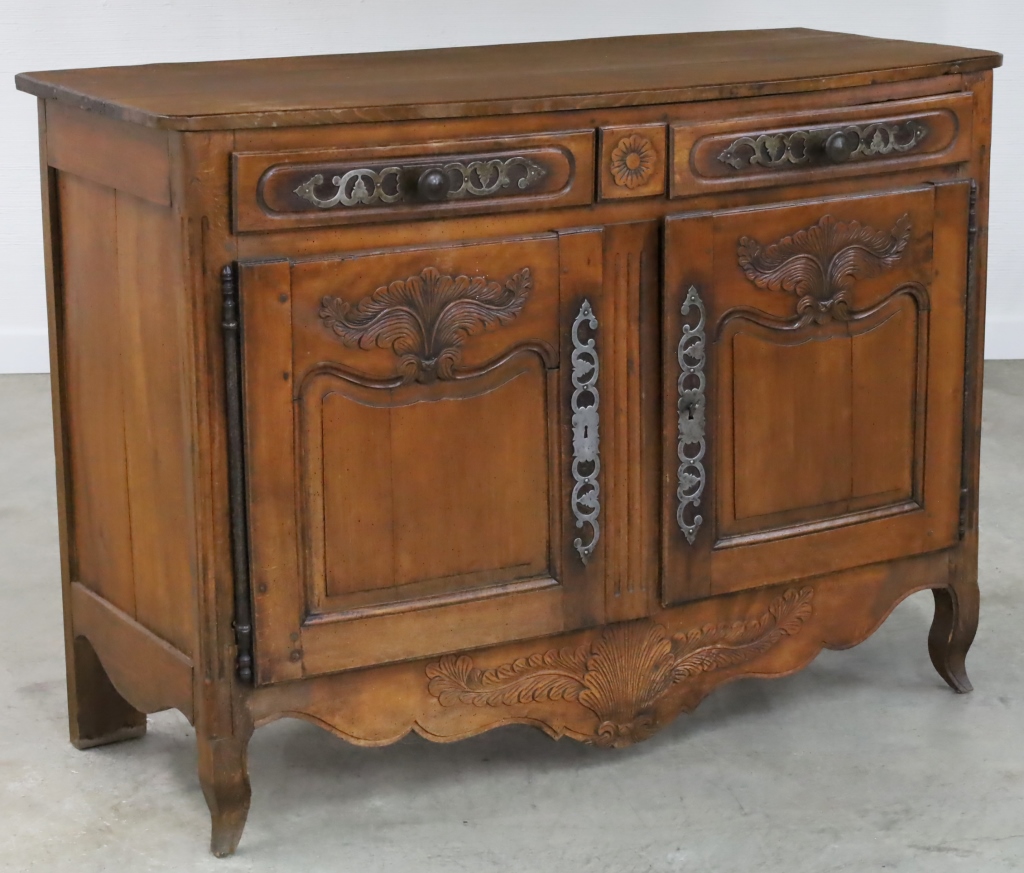 Appraisal: PROVINCIAL LOUIS XV STYLE WALNUT BUFFET Provincial Louis XV style