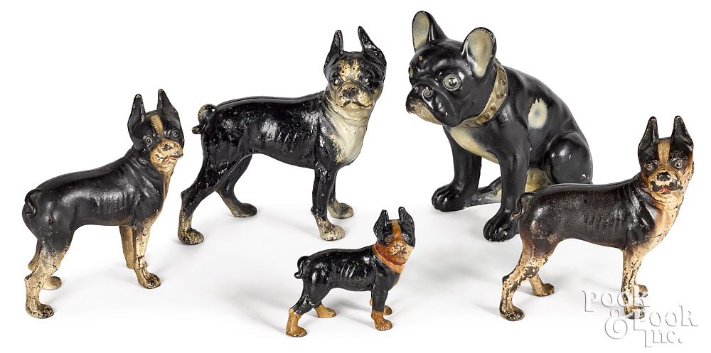 Appraisal: Four painted cast iron dog doorstops and another Four painted