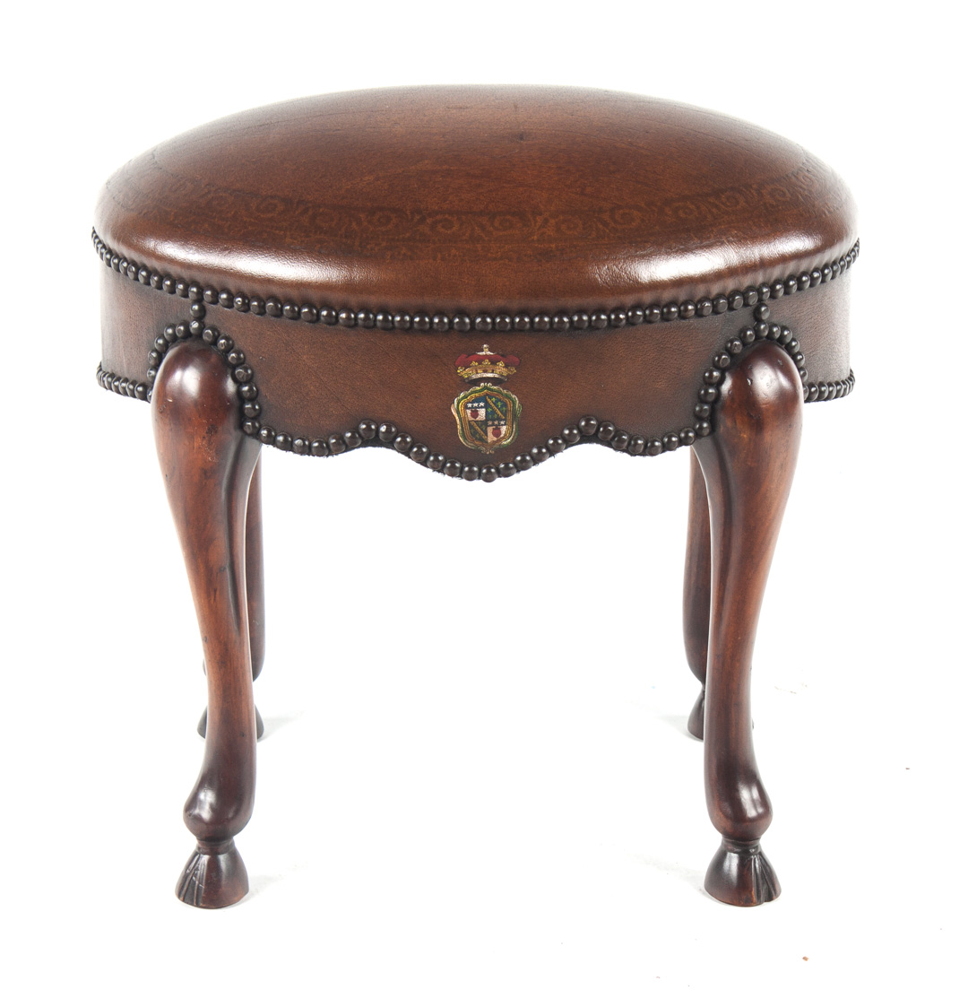 Appraisal: Irish Chippendale style mahogany footstool leather upholstered frame with brass