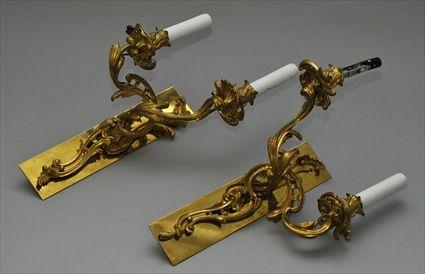 Appraisal: PAIR OF LOUIS XV-STYLE GILT-BRONZE TWO-LIGHT WALL APPLIQUES Each scroll