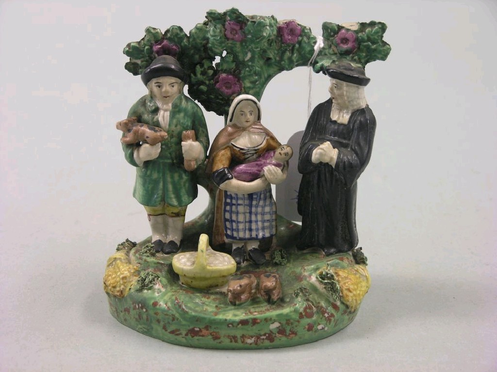 Appraisal: A Victorian Staffordshire figure group The Tithe Pig in -