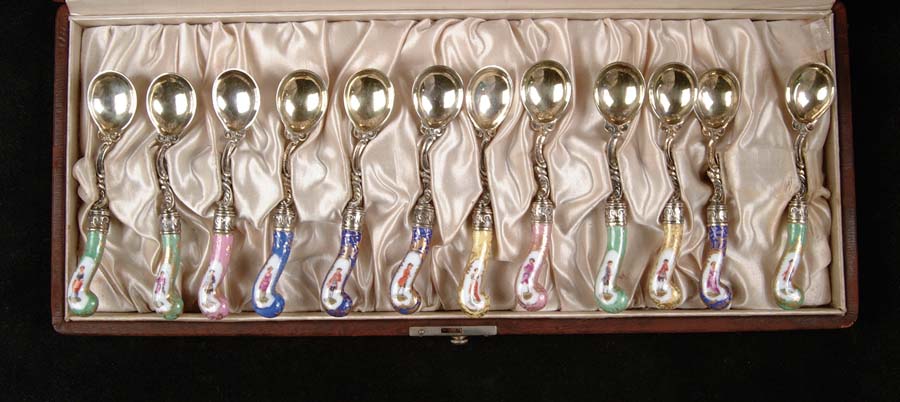 Appraisal: SET OF TWELVE SILVER AND PORCELAIN DEMITASSE SPOONS Very nice