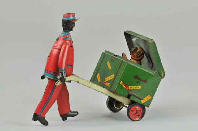 Appraisal: STRAUSS RED CAP PORTER WITH LUGGAGE Lithographed tin amusing toy