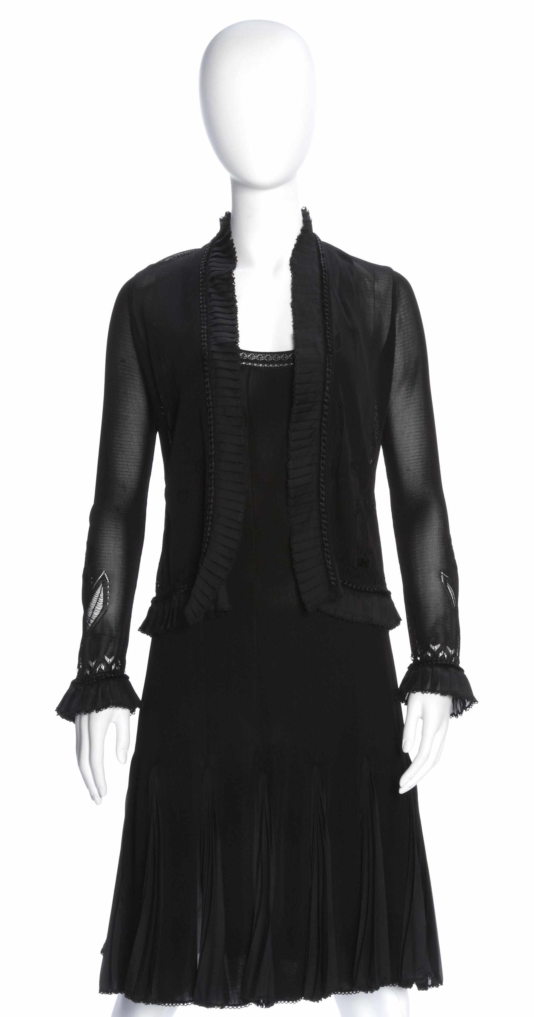 Appraisal: A Chanel short black knit dress with chiffon kick pleatssize