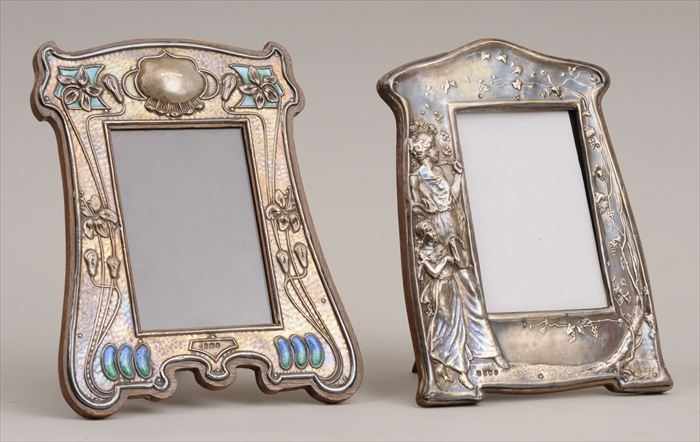 Appraisal: TWO ENGLISH ART NOUVEAU SILVER-ON-OAK PICTURE FRAMES Marks for Birmingham