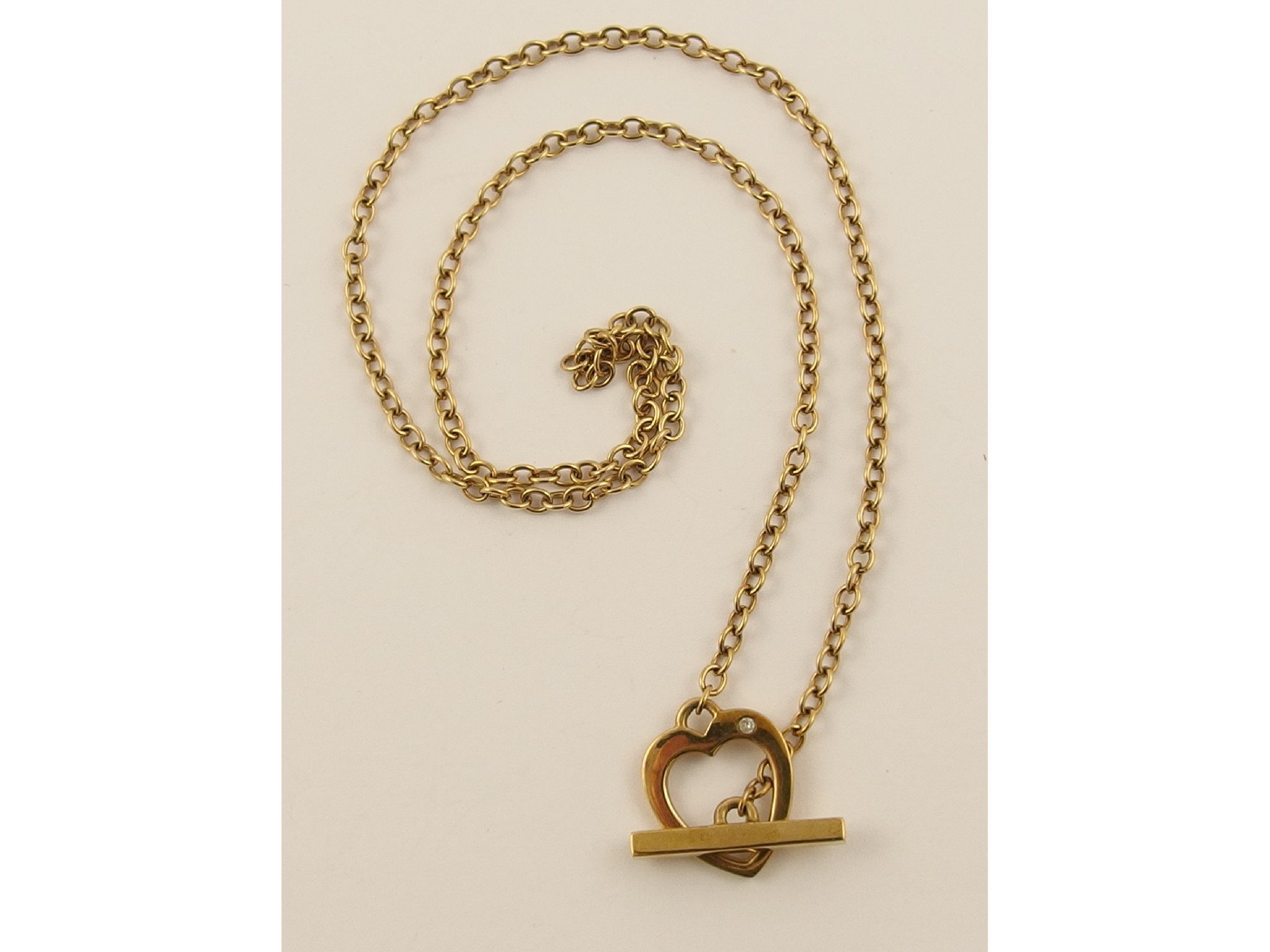 Appraisal: A ct heart necklace set with a diamond