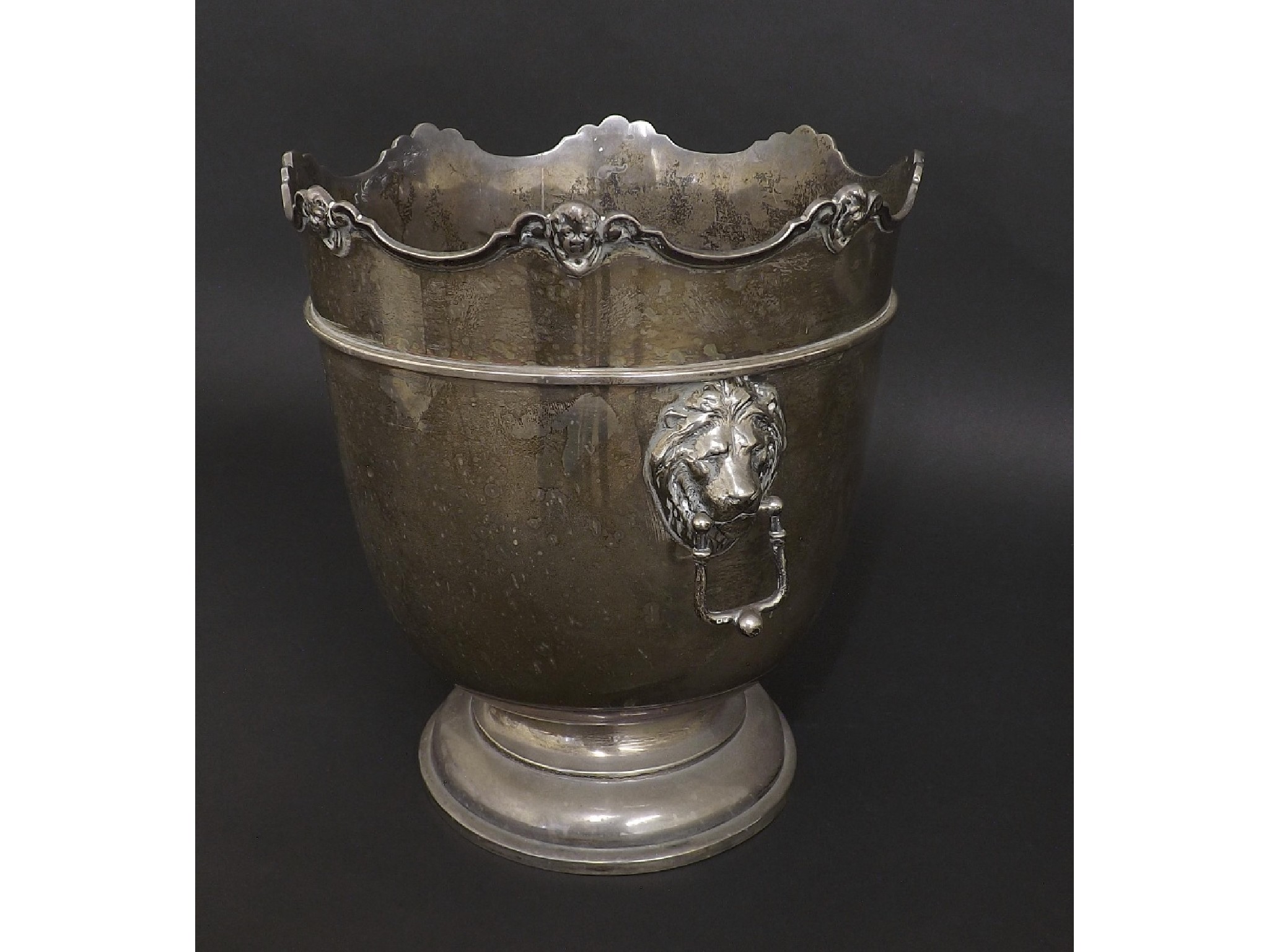 Appraisal: Edwardian silver ice bucket the wavy rim cast with cherub