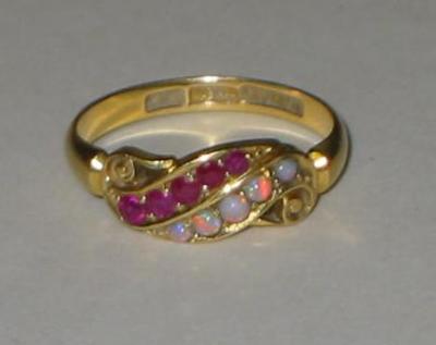 Appraisal: A VICTORIAN RUBY AND OPAL RING the ct gold and