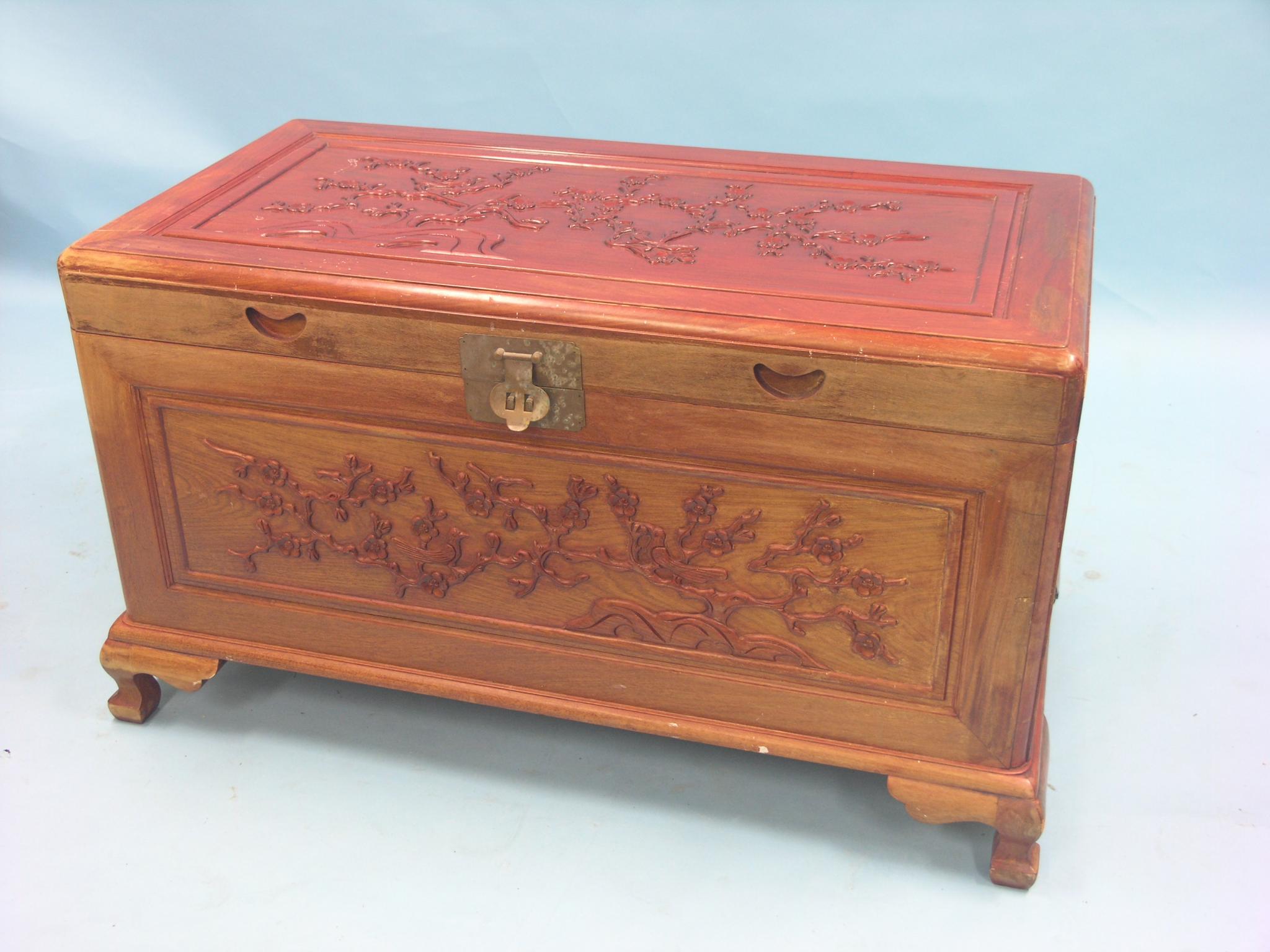 Appraisal: A Chinese carved hardwood blanket chest panelled construction on cabriole