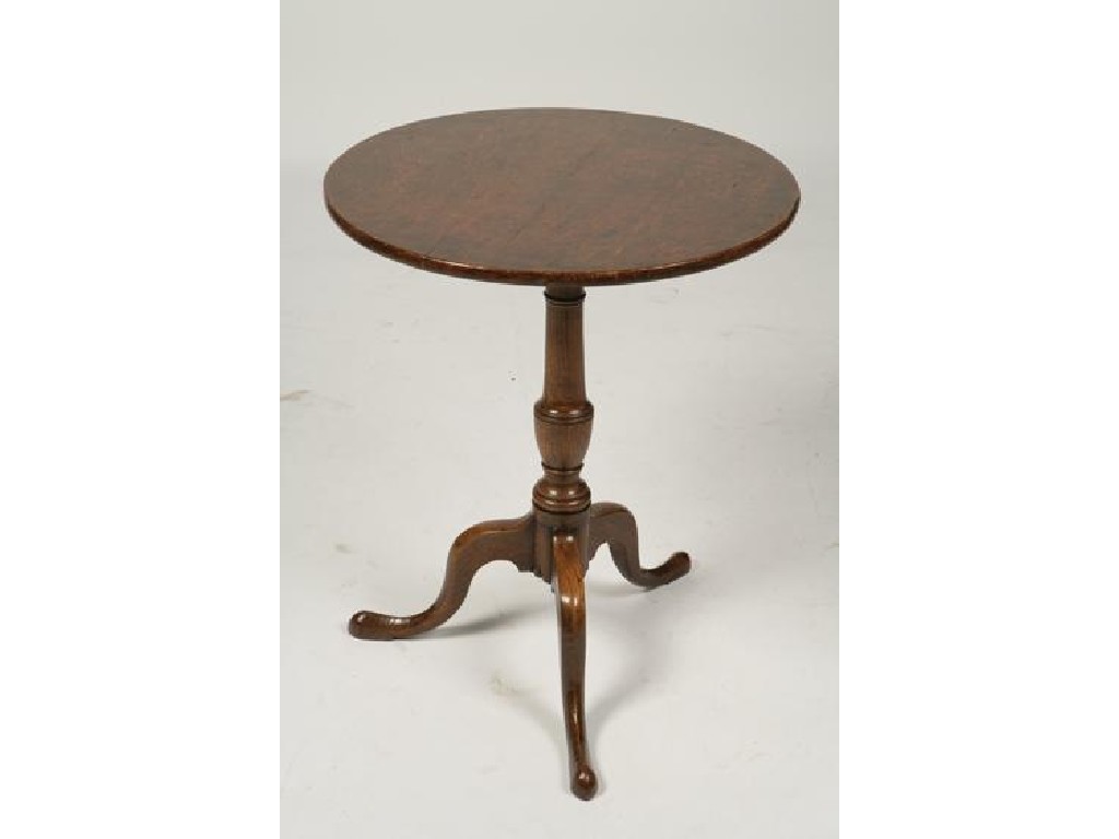 Appraisal: A GEORGE III OAK OCCASIONAL TABLE the circular top on