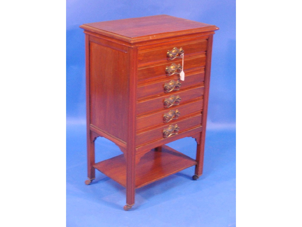 Appraisal: An Edwardian walnut music pedestal fitted with six drawers and