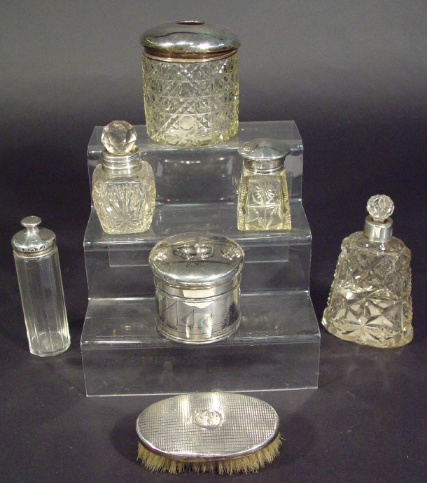 Appraisal: Group of silver topped cut glass bottles and jars a