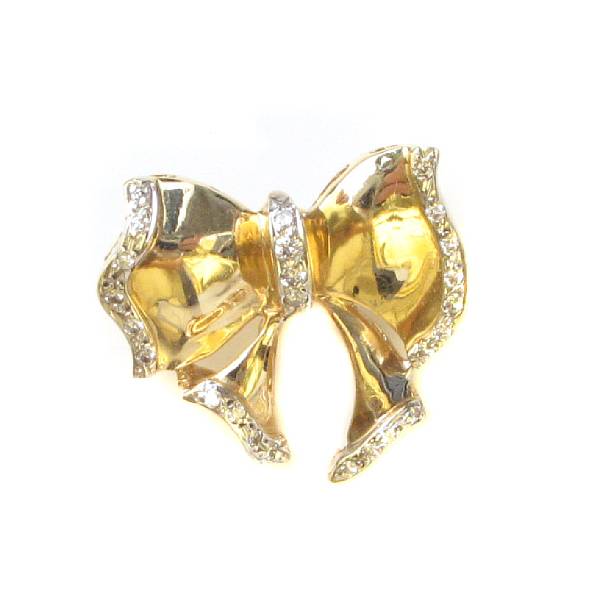 Appraisal: A diamond and two-toned gold bow brooch