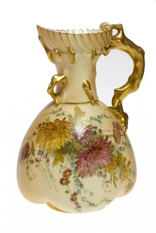 Appraisal: A ROYAL WORCESTER CORAL-HANDLED JUG of lobed form with shell