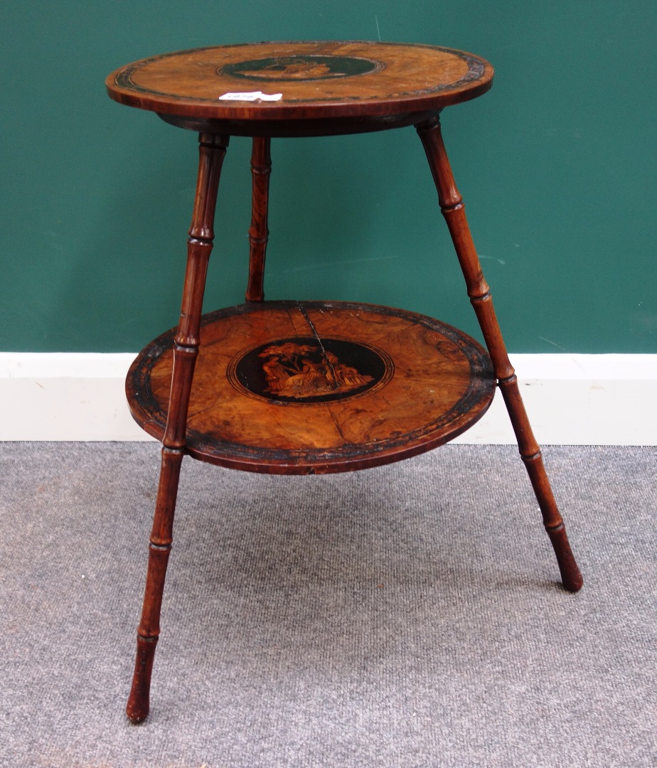 Appraisal: A th century Sorrento circular two tier occasional table on