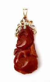 Appraisal: A ct gold brown jade and diamond set pendant carved