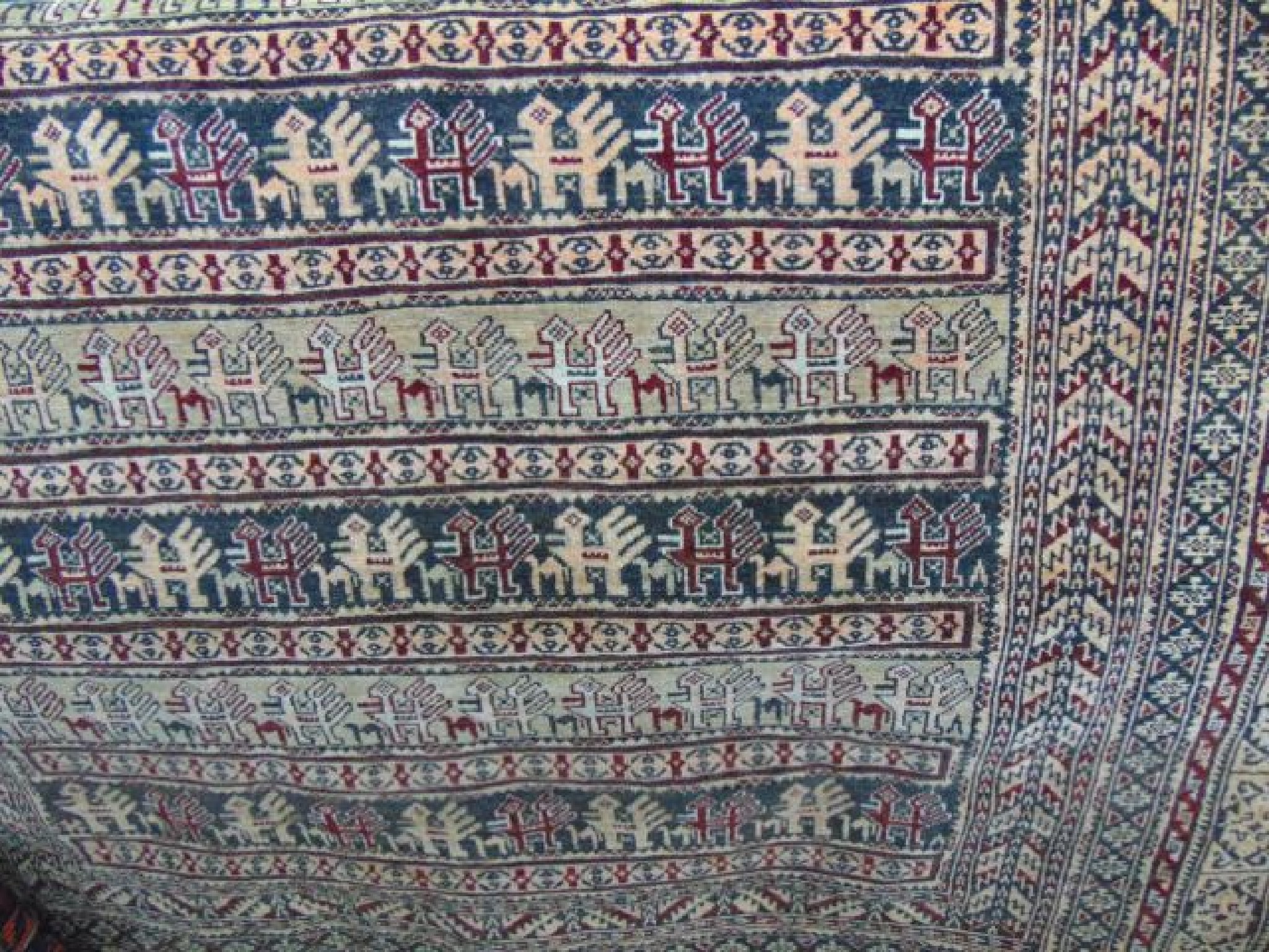 Appraisal: A Persian wool rug with camel bird and other parallel