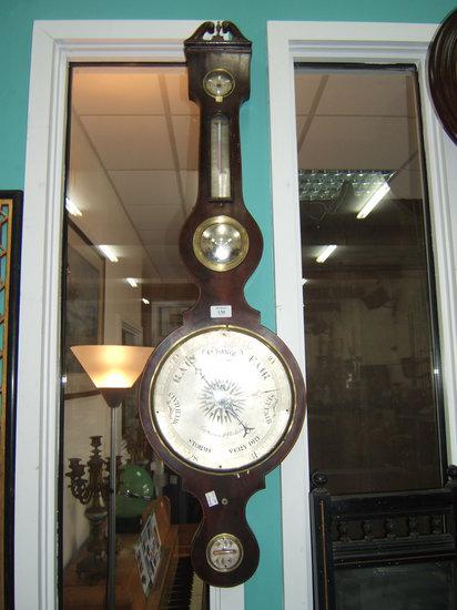 Appraisal: A Victorian mahogany wheel barometer with break arch pediment hygrometer