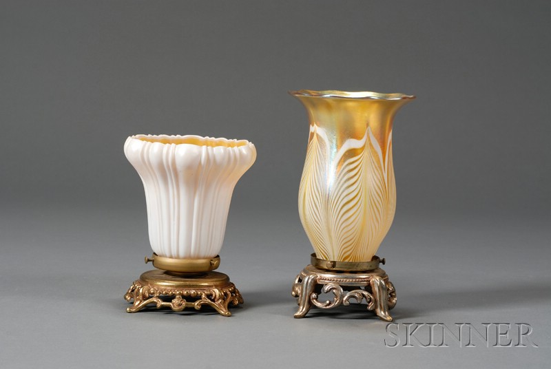 Appraisal: Steuben and Quezal Candle Lamps Iridescent glass and gilt-metal Early