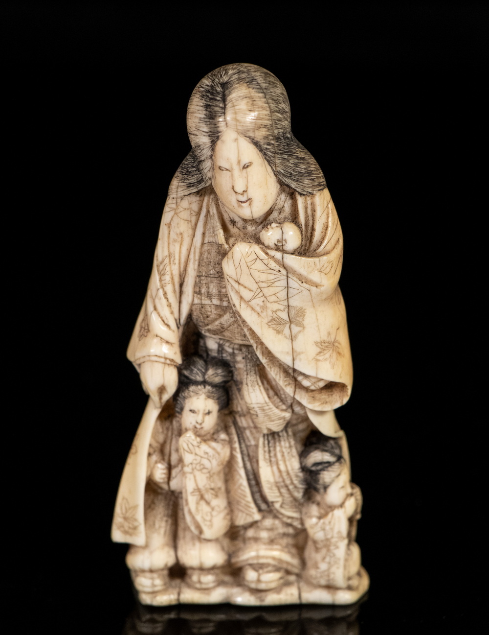 Appraisal: TH C JAPANESE IVORY OKIMONO OF A MOTHER Standing Figure