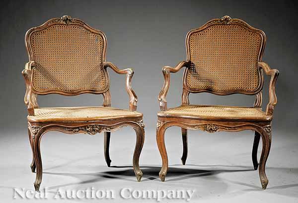 Appraisal: A Pair of Louis XV Carved Walnut Armchairs mid- th