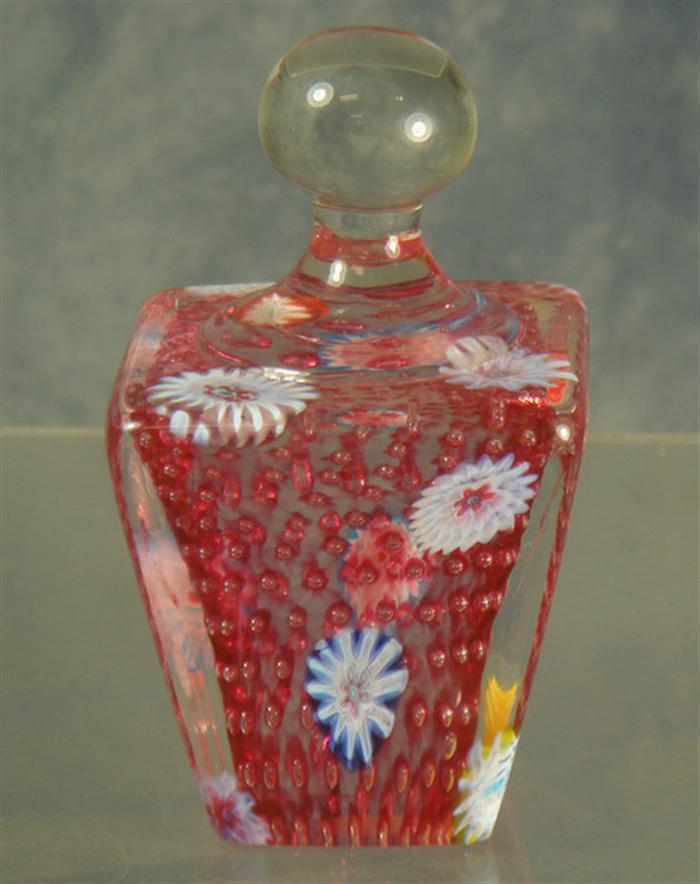 Appraisal: Murano cranberry paperweight with enameled flowers air bubble interior h