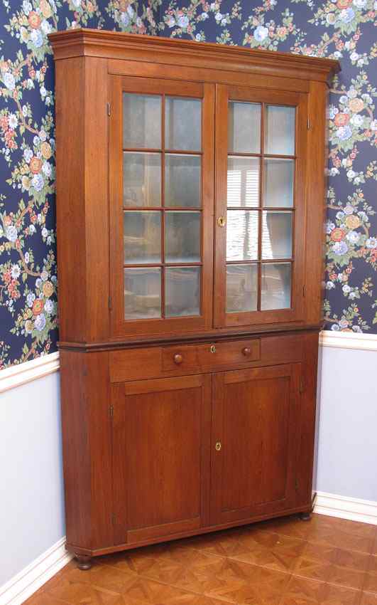 Appraisal: LARGER THAN MOST MARYLAND WALNUT CORNER CUPBOARD In two parts