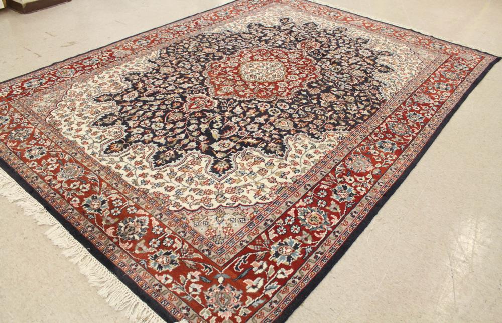 Appraisal: HAND KNOTTED ORIENTAL CARPET Indo-Persian floral and central floral medallion