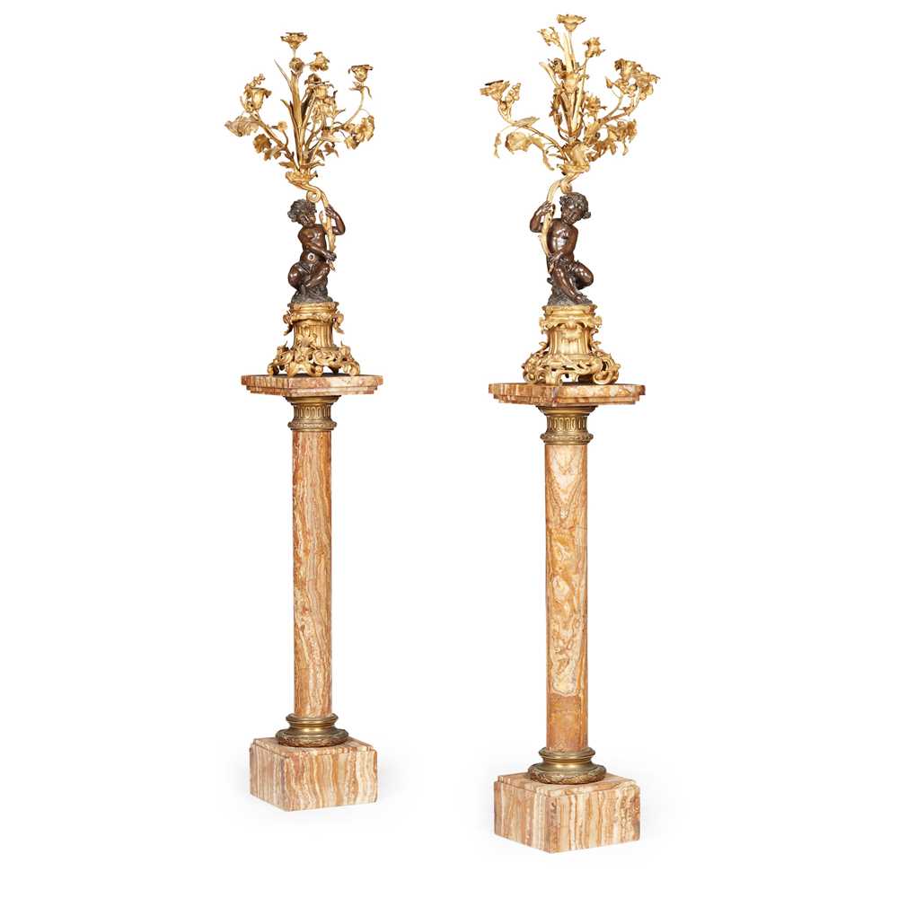 Appraisal: PAIR OF FRENCH GILT AND PATINATED BRONZE FIGURAL CANDELABRA WITH