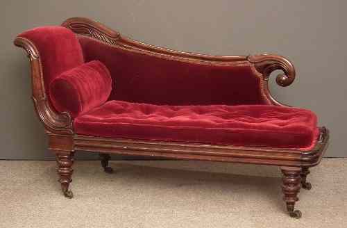 Appraisal: A Victorian mahogany framed chaise longue with leaf capped showwood