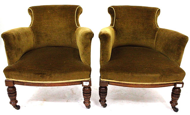 Appraisal: A PAIR OF VICTORIAN GREEN UPHOLSTERED TUB CHAIRS with scrolling