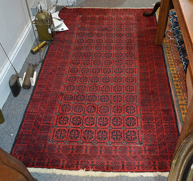 Appraisal: Pakistan red ground rugwith central panel of geometric designs cm