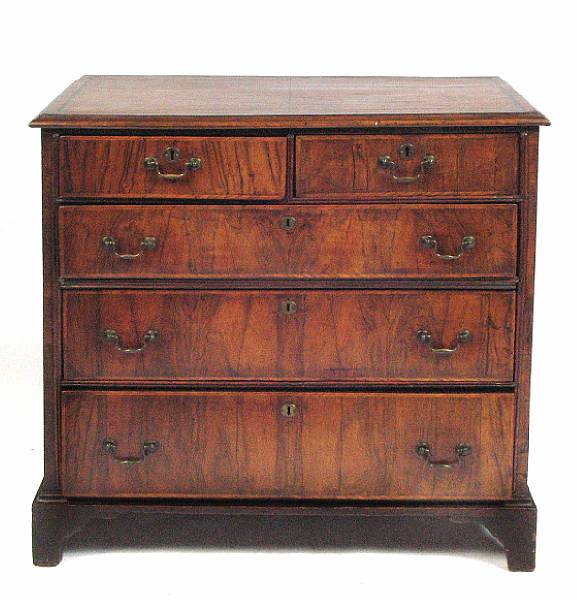 Appraisal: A George II walnut chest with two short and three