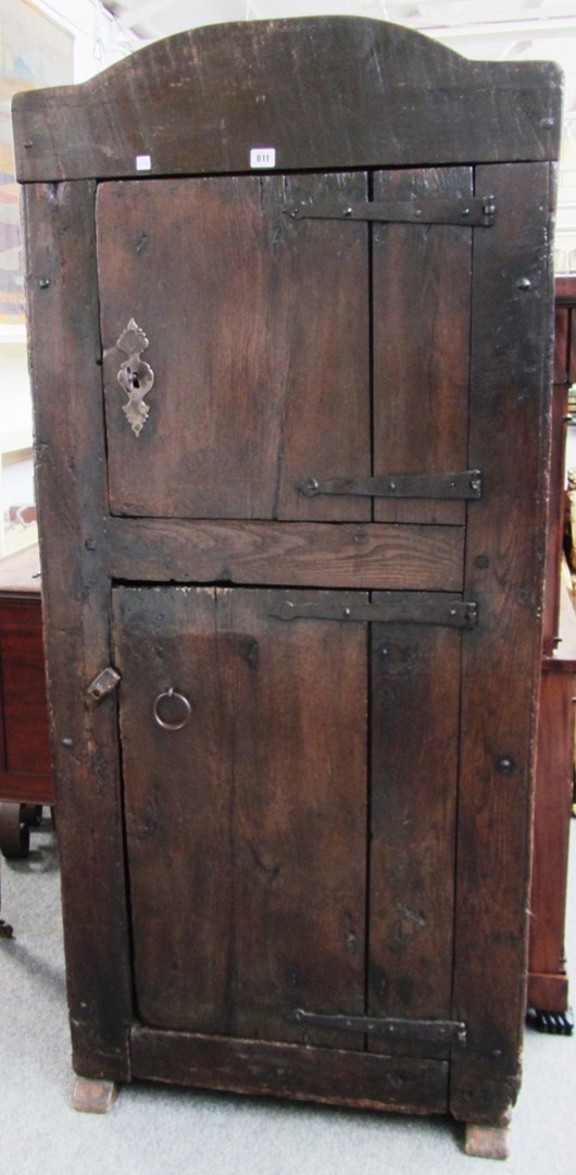 Appraisal: An th century continental chestnut two door cupboard on sleigh