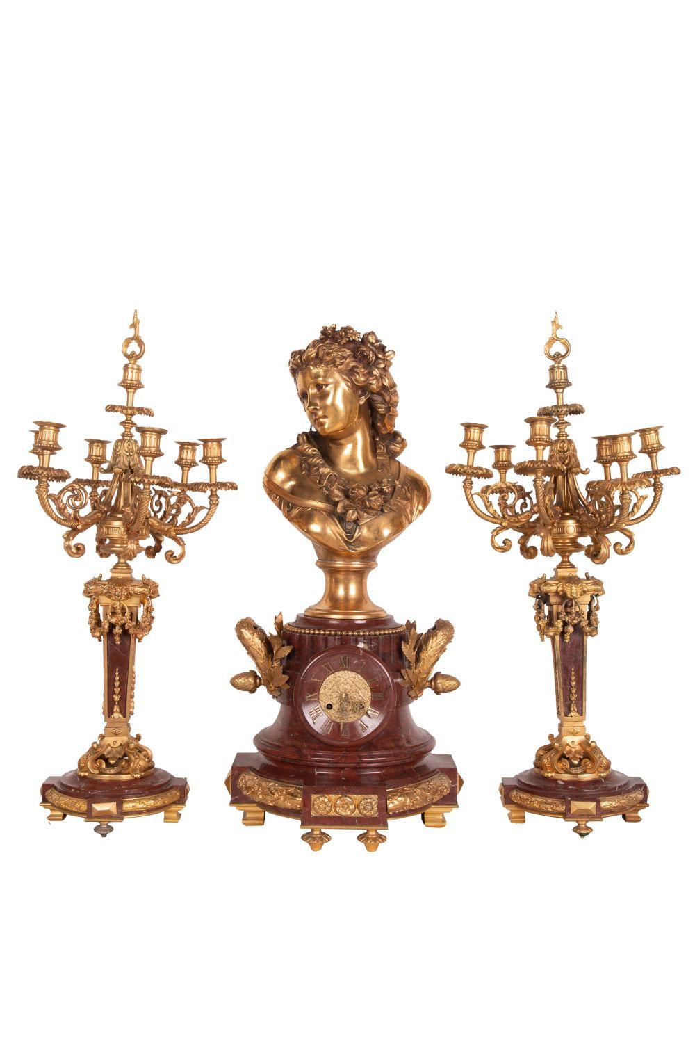 Appraisal: FRENCH GILT BRONZE ROUGE MARBLE CLOCK GARNITUREthe bronze after Albert-Ernest