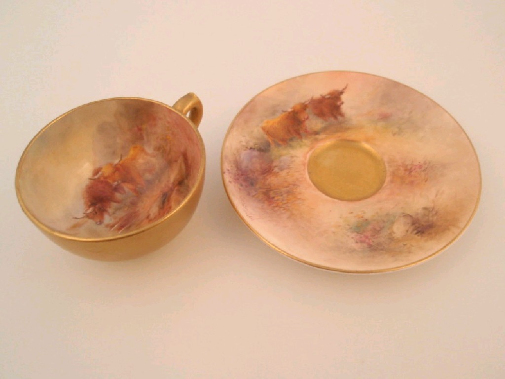 Appraisal: A Royal Worcester porcelain miniature cup and saucer the cup