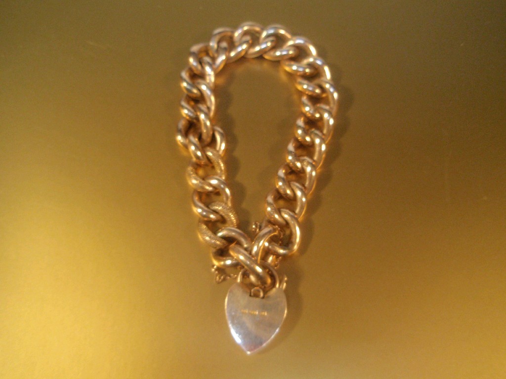 Appraisal: A large hollow curb link ct rose gold bracelet with