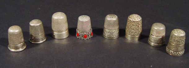 Appraisal: Six hallmarked silver thimbles one in a case and some