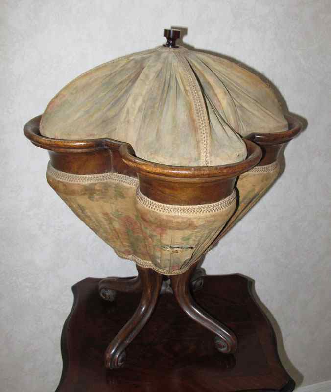 Appraisal: GERMAN WALNUT WORK BASKET Mid th C Clover form compartment