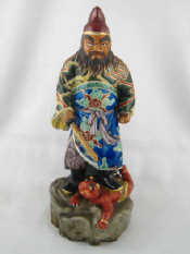 Appraisal: A ceramic figure in bright enamels of a Chinese warrior