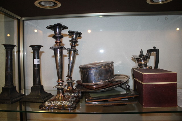 Appraisal: A PAIR OF SHEFFIELD PLATED COLUMN CANDLESTICKS with square bases