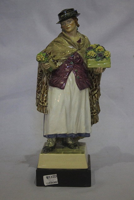 Appraisal: A CHELSEA POTTERY MODEL OF A FLOWER SELLER The Shawl