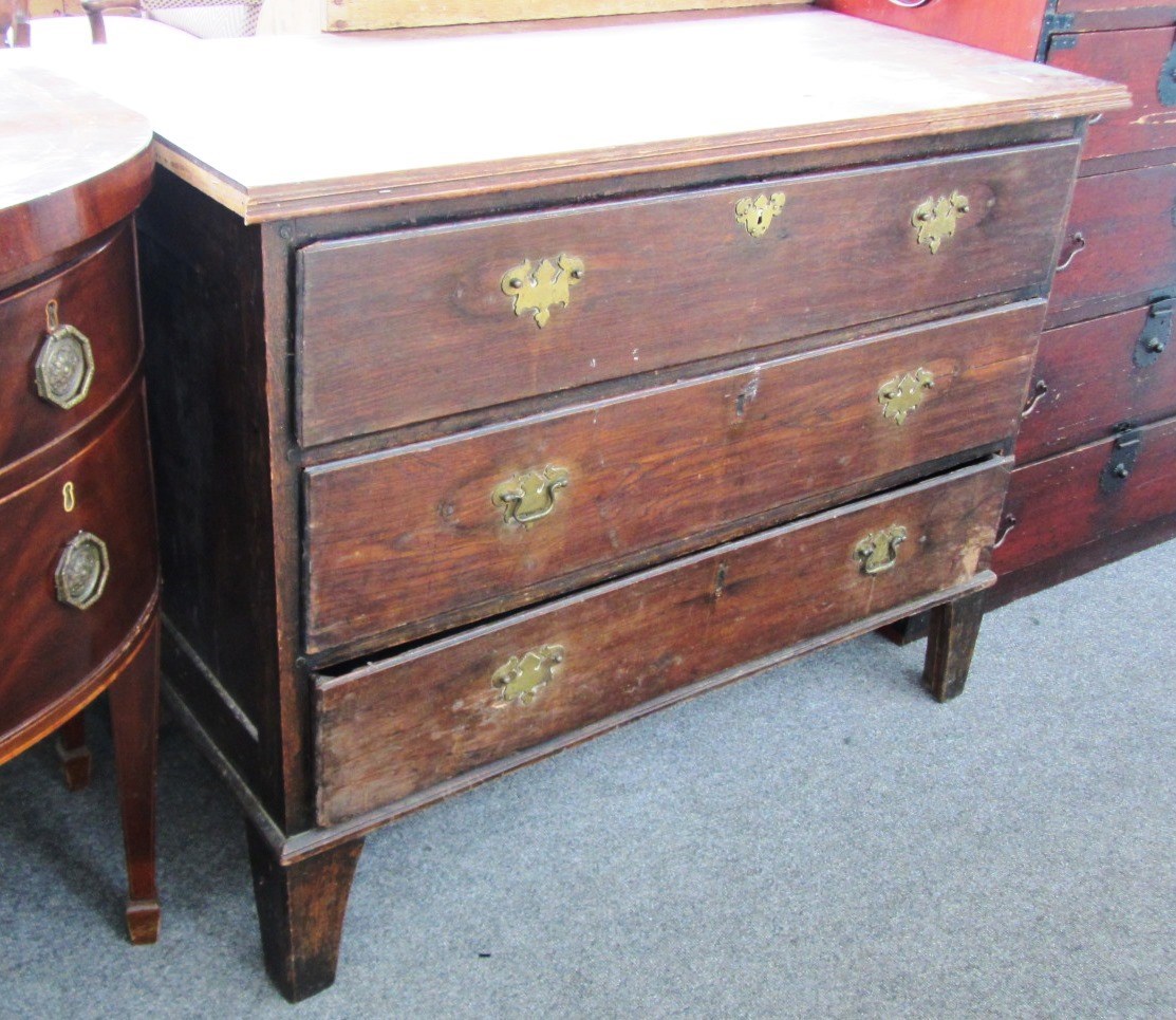 Appraisal: A continental oak chest th century with three long drawers