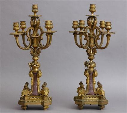 Appraisal: PAIR OF REGENCE-STYLE RED MARBLE AND GILT-BRONZE FIVE-LIGHT CANDELABRA Each