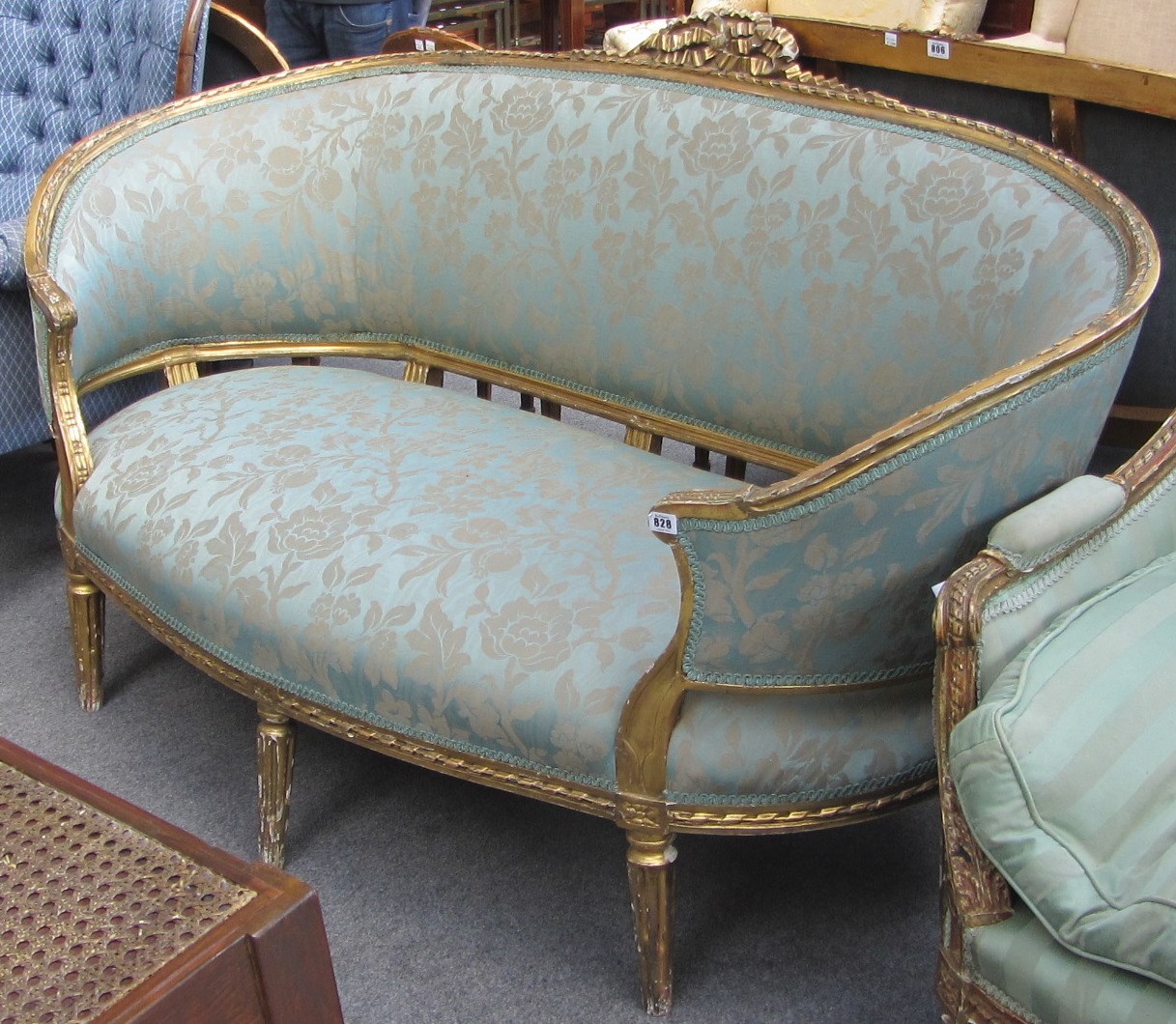 Appraisal: A Louis XVI style gilt framed tub back sofa with